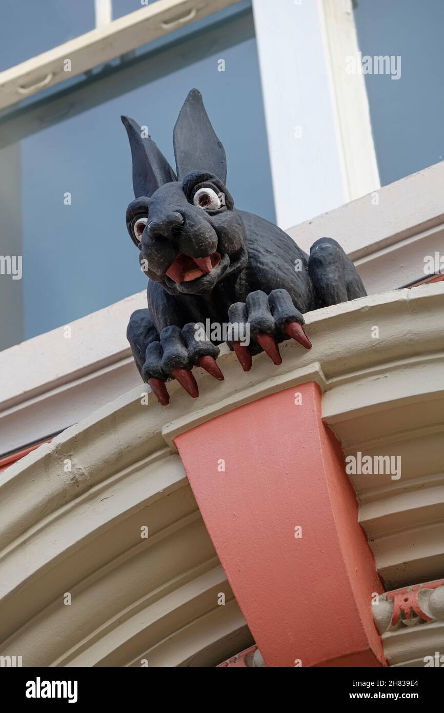 The 'Vampire Rabbit', a grotesque over the  rear door of the historic Cathedral Buildings, opposite the rear of St Nicholas Cathedral, Newcastle upon Stock Photo