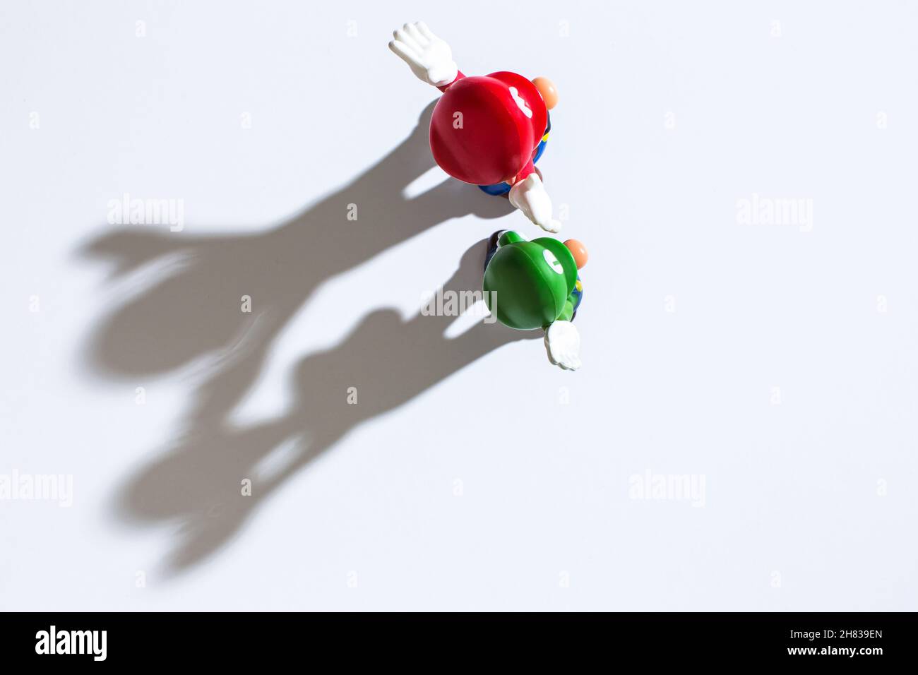 Moscow, Russia - November 27, 2021: Top view of plastic figure of Mario and Luigi from Nintendo video game. Stock Photo
