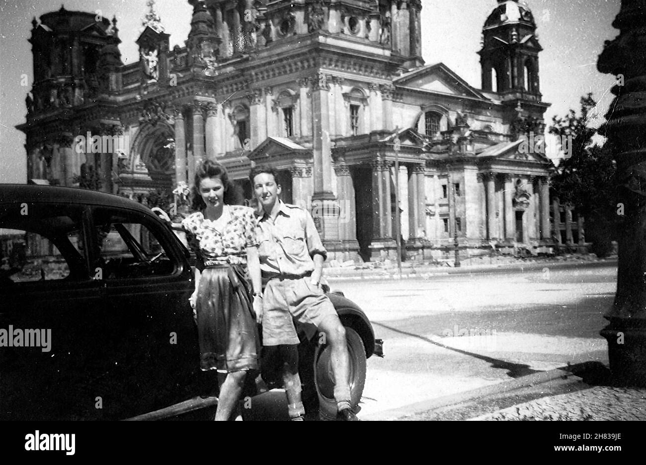 In August 1947 RAF pilot-officer Browne visited Berlin and took a female companion on a sightseeing tour of the city. Here they are posed in front of the ruins of the Free Cathedral. The girl is unknown, possibly a waitress going by her apron. P/O Browne flew into Berlin Gatow on 12th August 1947 and flew out to RAF Bückeberg on 19th August 1947. Stock Photo