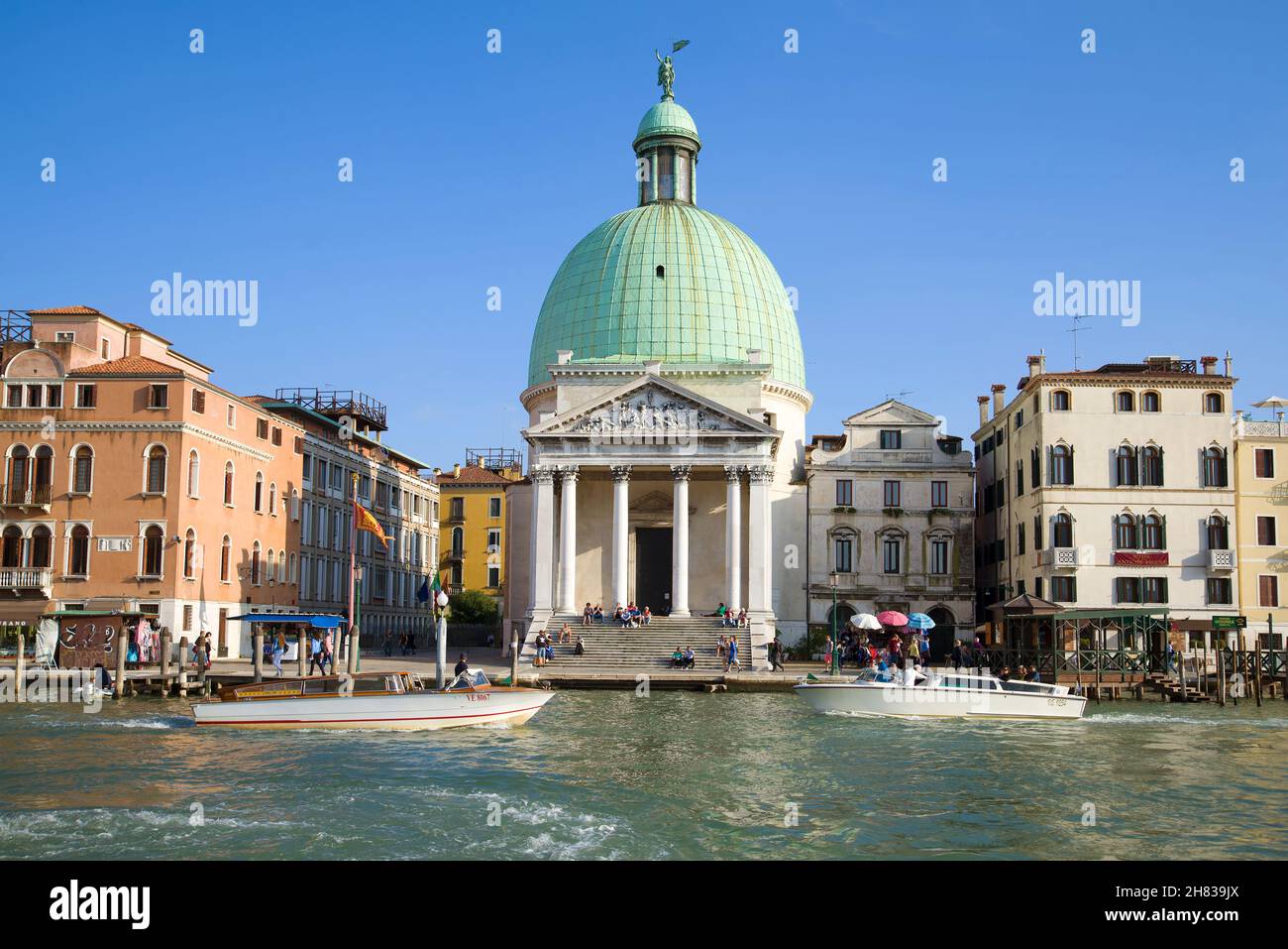 VENICE, ITALY - SEPTEMBER 26, 2017: View of the church of San Simeon Piccolo on the Grand Canal Embankment on a sunny afternoon Stock Photo