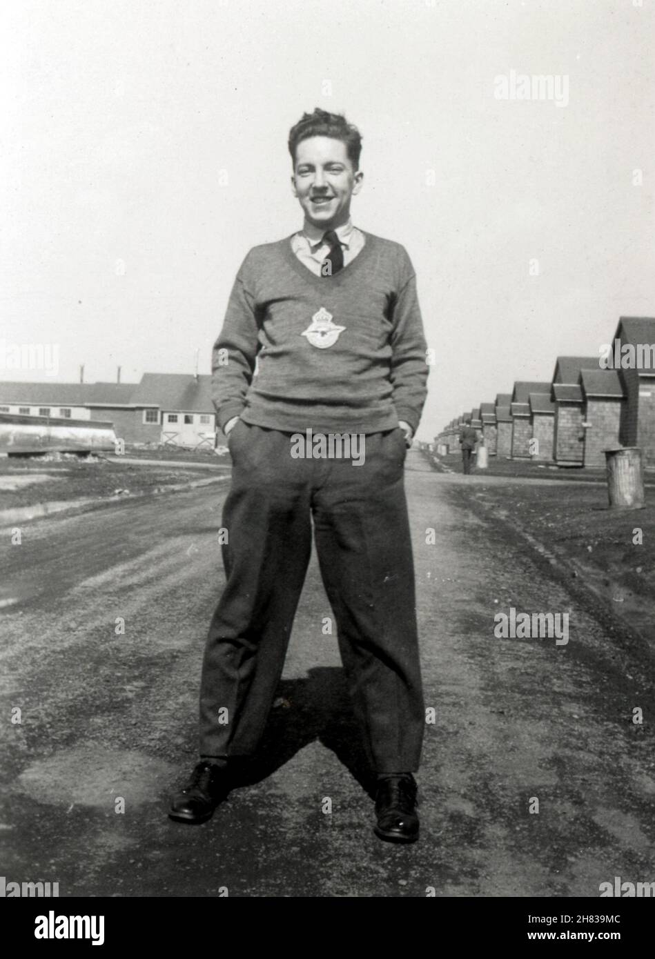 January - March 1944. LAC Browne pictured outside the barracks at CFB Picton Bombing and Gunnery School (B&GS), Ontario, Canada. He completed course no.31 on 22nd March 1944. Six bombs were dropped from Avro Ansons on each training flight, night and day. Stock Photo
