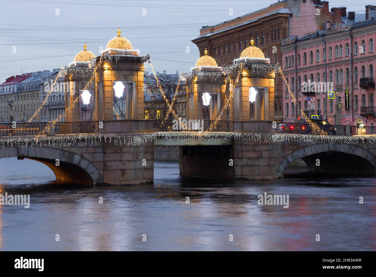 ST PETERSBURG, RUSSIA - DECEMBER 18, 2017: Lomonosov Bridge in the New Year's illumination on a cloudy December morning Stock Photo