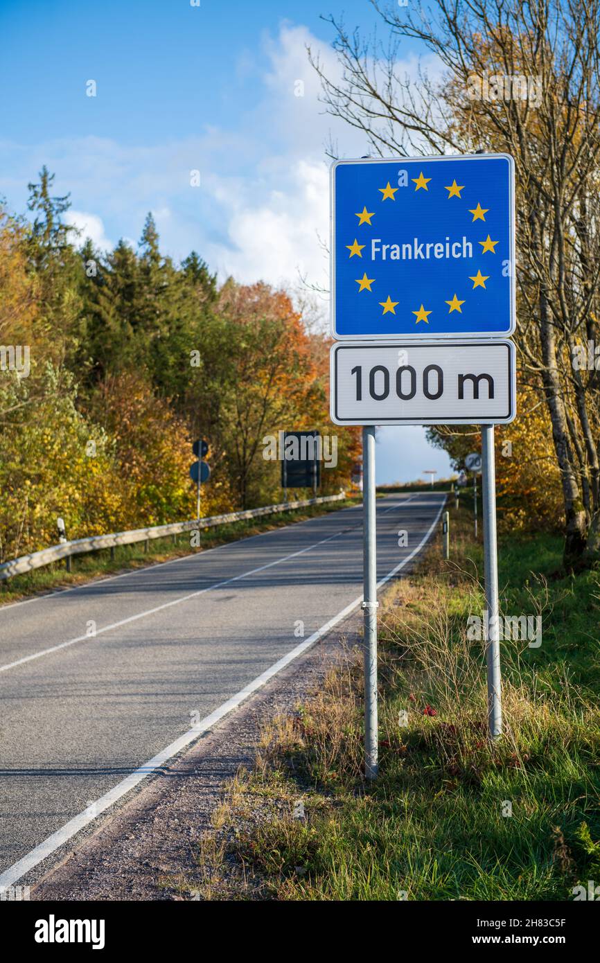 Sign indicating the French border in German Stock Photo