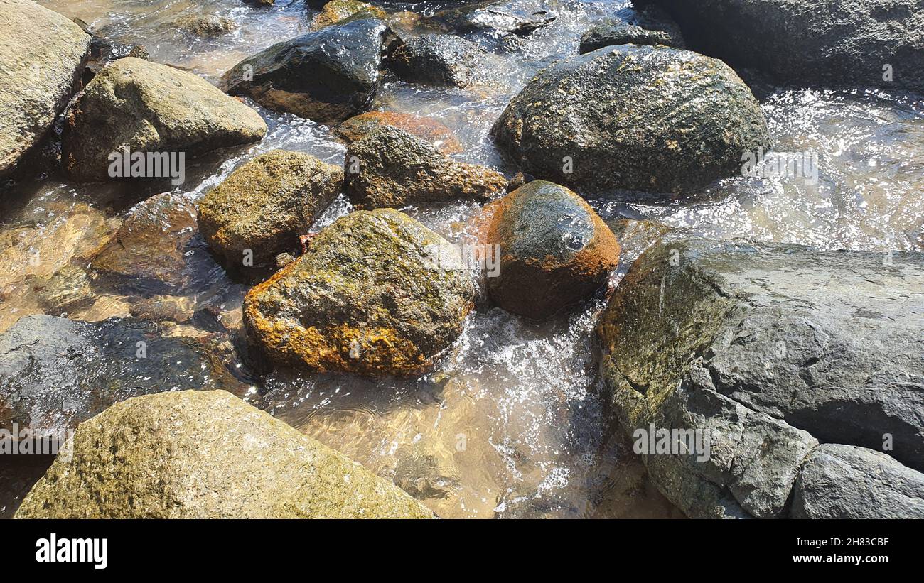 Close-up of some rocks by the sea, in Ilhabela, São Paulo, Brazil Stock Photo