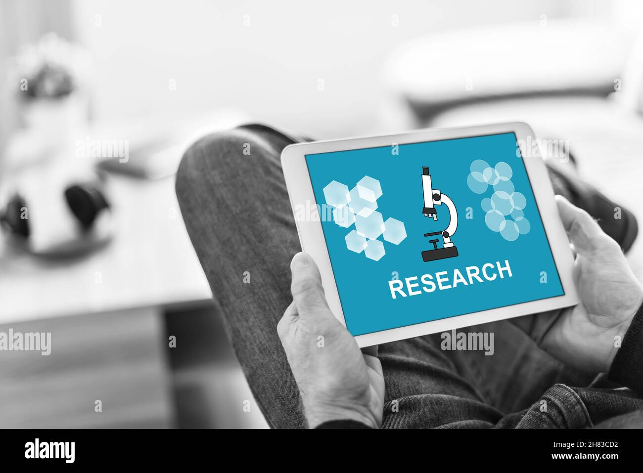 Tablet screen displaying a research concept Stock Photo Alamy