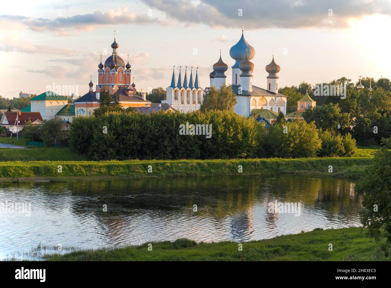 Sunny August evening on the Tikhvinka River. Tikhvin, Leningrad region. Russia Stock Photo