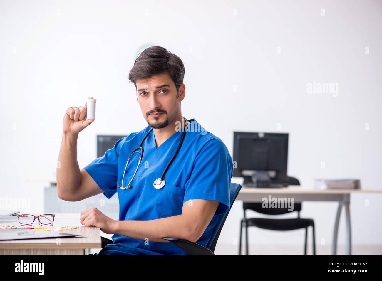 Young male doctor working at the hospital Stock Photo - Alamy