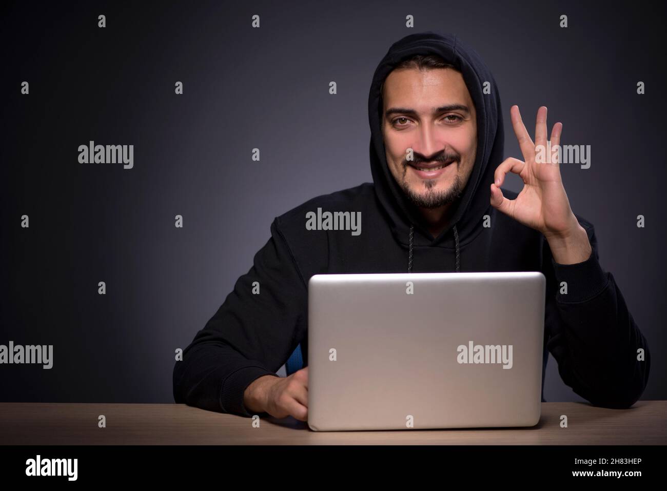 Male student hacker in hood hi-res stock photography and images - Alamy