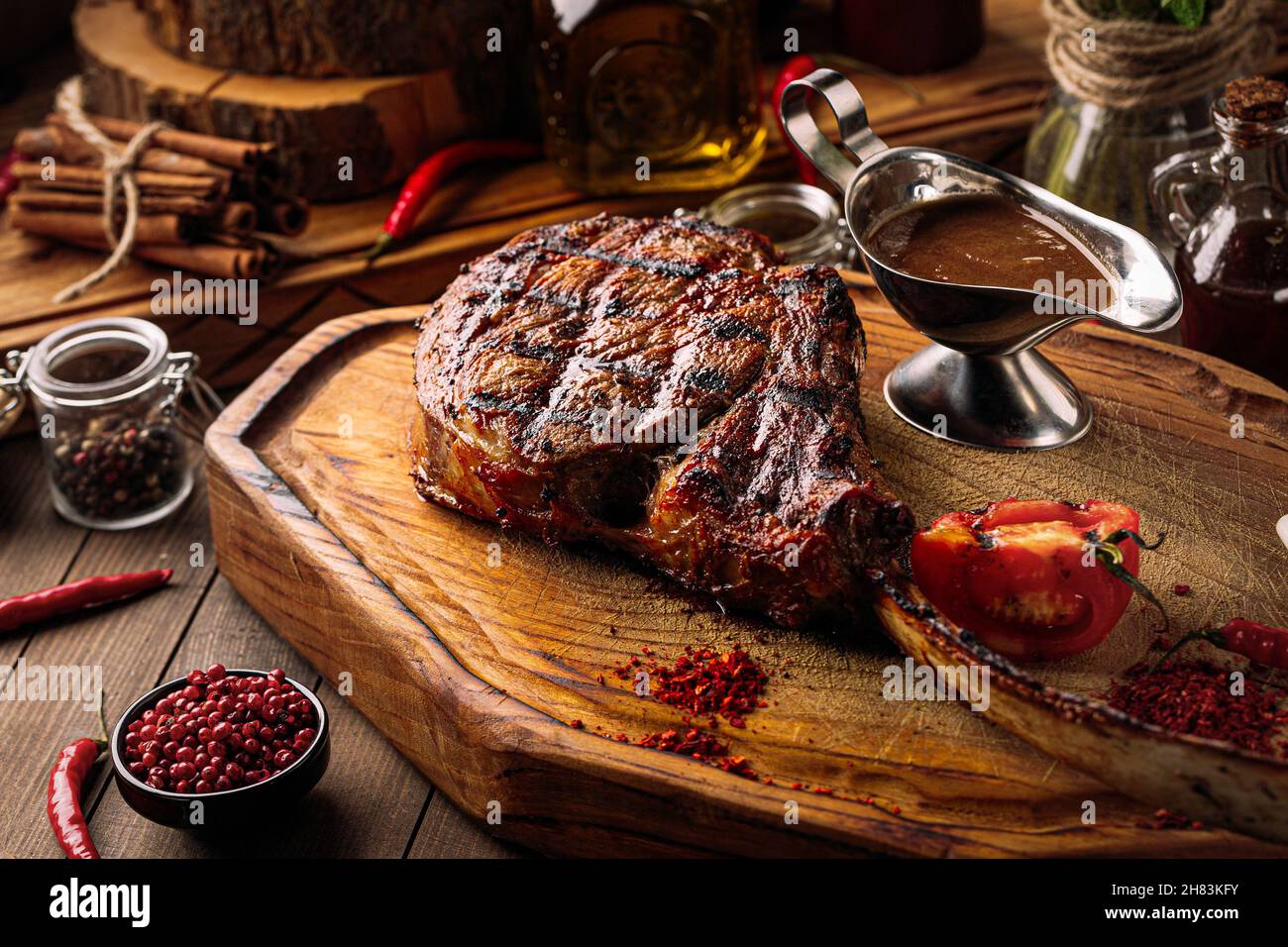 Grilled beef tomahawk steak with pepper sauce Stock Photo
