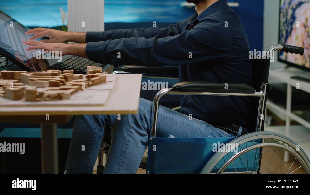 Architect with disability analyzing building model and using touch ...