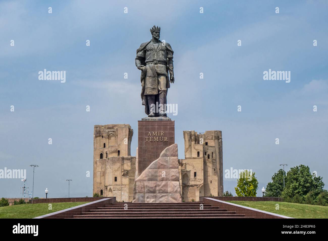 Central historical part of city Shakhrisabz, Uzbekistan. Statue of Timur (Tamerlane), in the distance you can see the gates of the medieval palace Ak Stock Photo