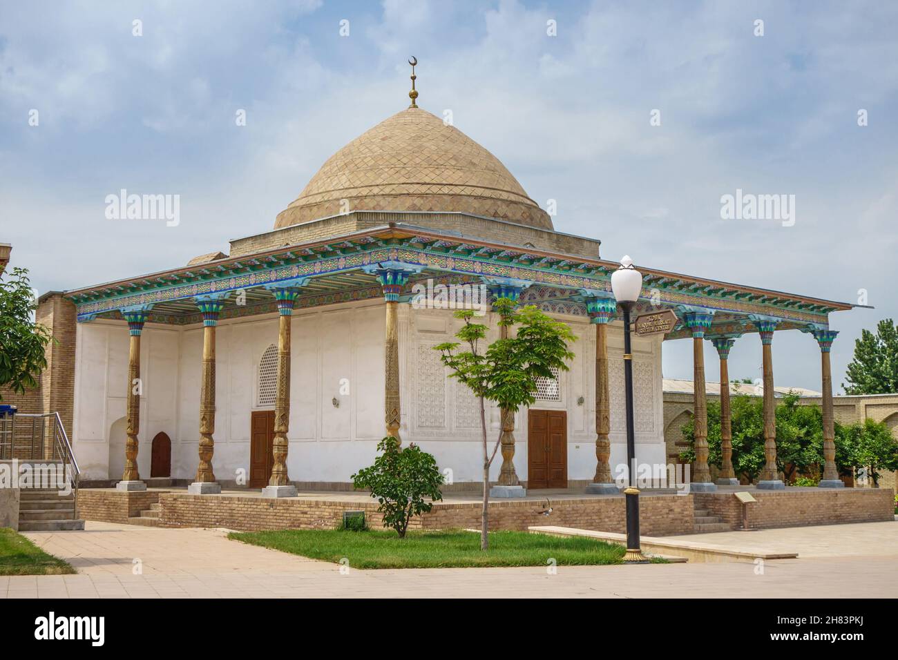 Facade of madrasah called Abdyshukur Agalik, Shakhrisabz, Uzbekistan. Building built in XIX in traditional style with carved column and painted ceilin Stock Photo