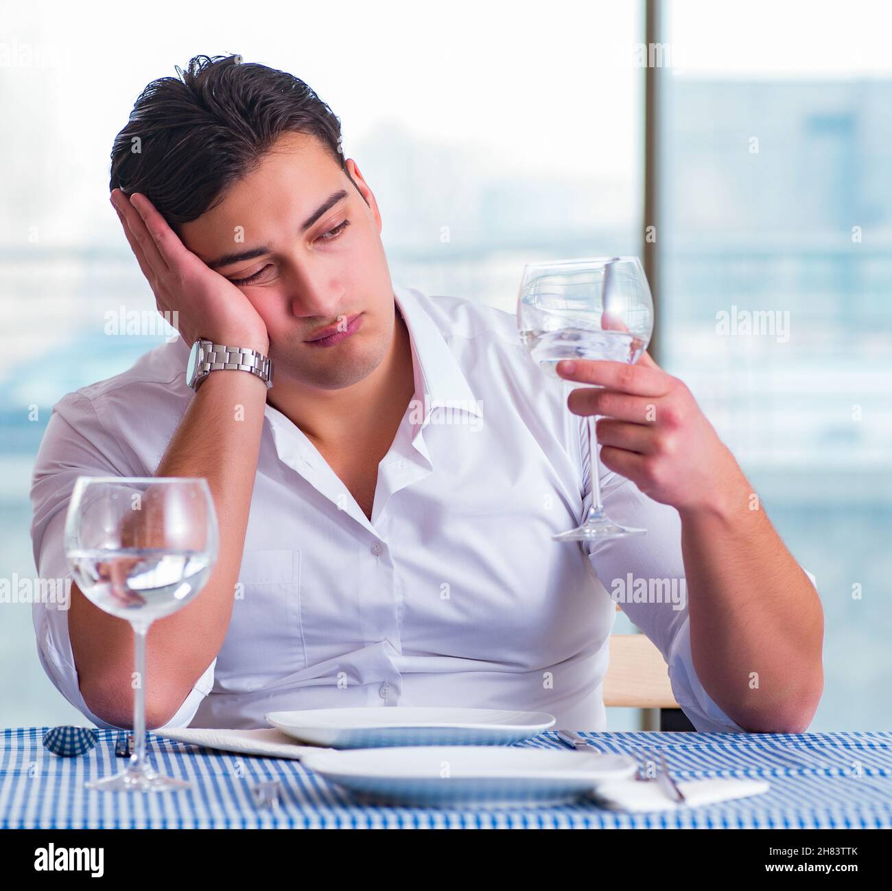 Sad man dining alone hi-res stock photography and images - Alamy