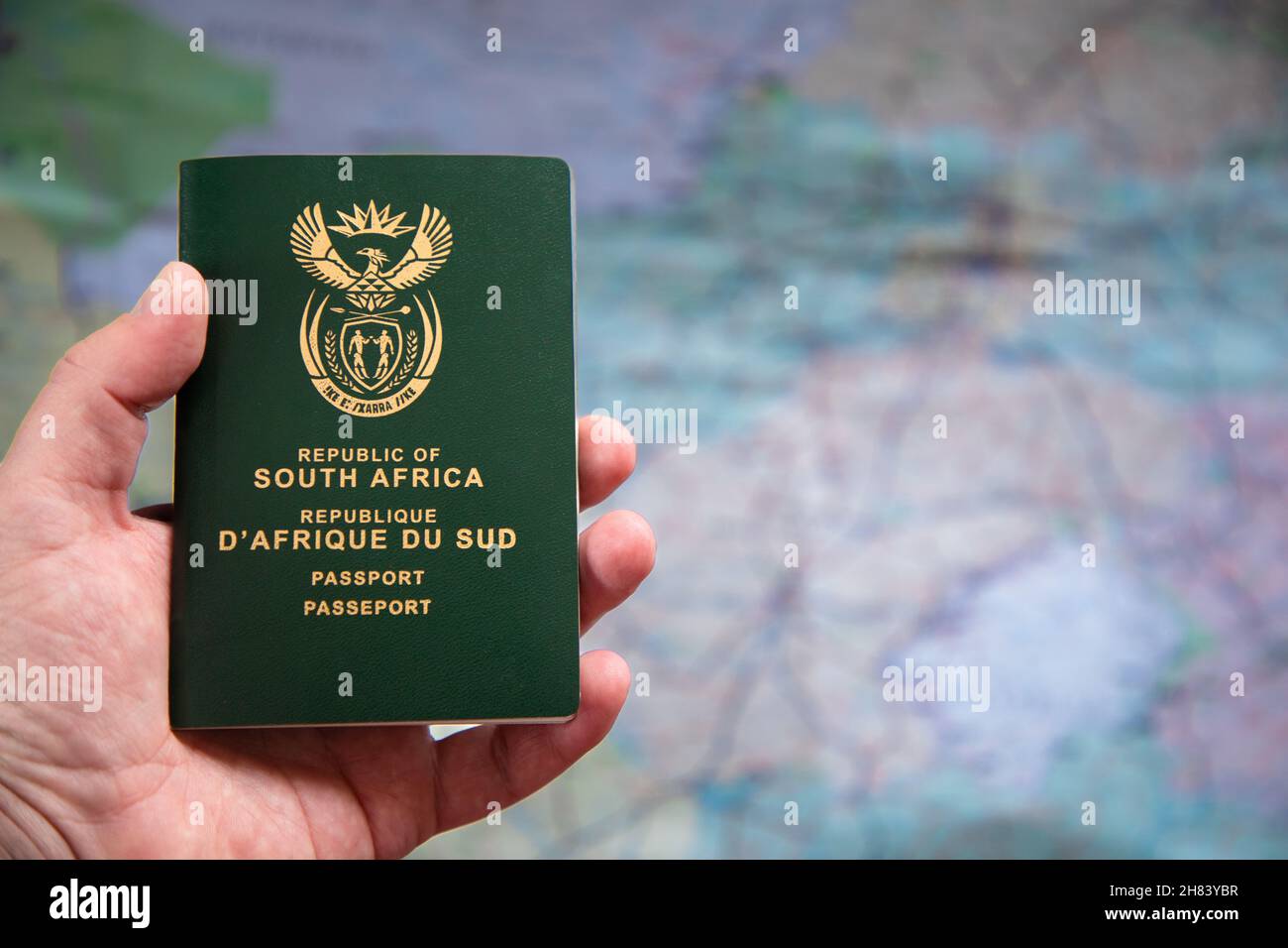 Selective focus on a South African Passport in a caucasian hand.  Concept for travel restrictions due to the omicron covid variant Stock Photo