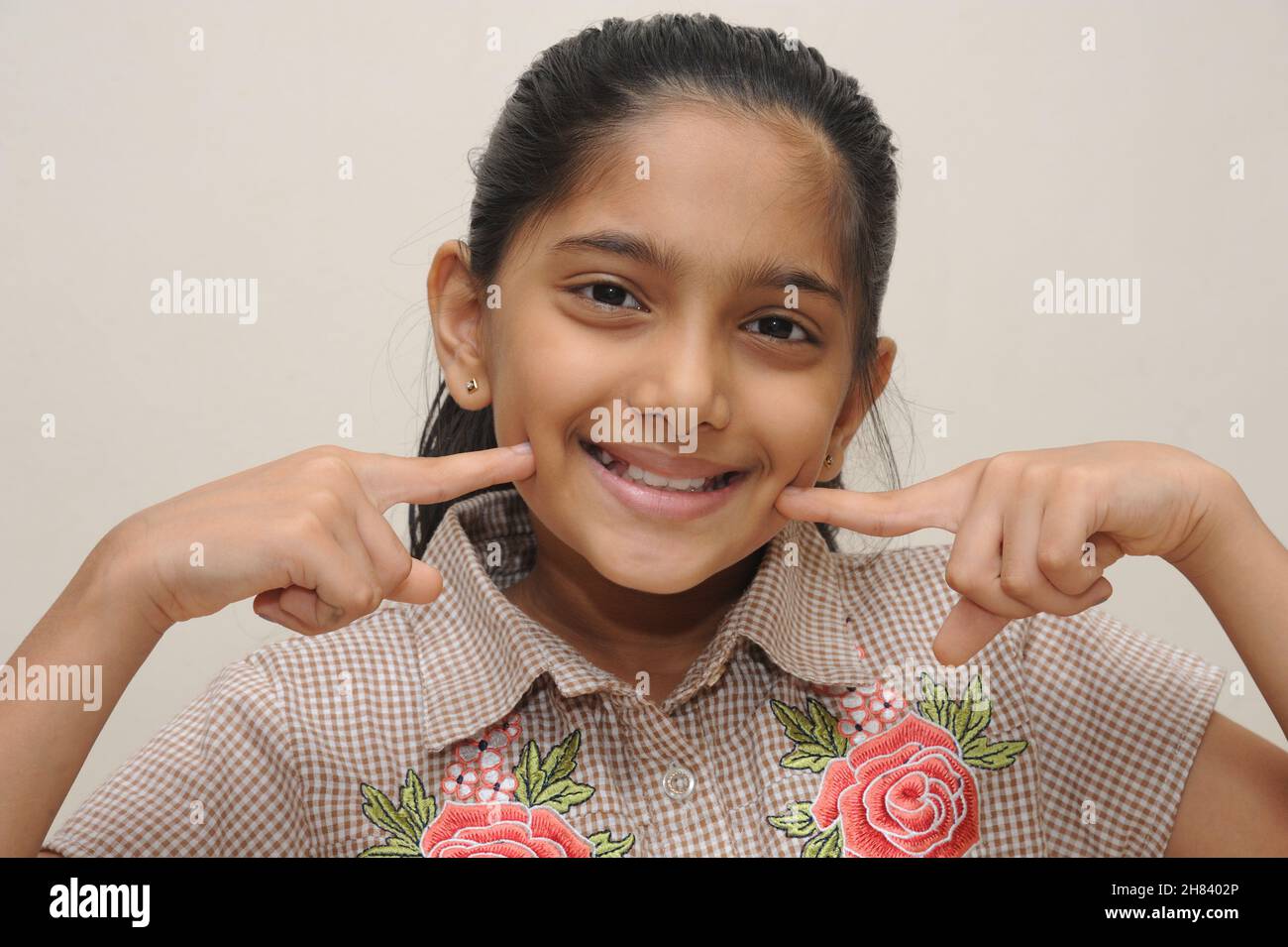 Mumbai Maharashtra India Asia Aug. 13 2021 Beautiful cute little eight years old indian girl smiling good morning concept Stock Photo