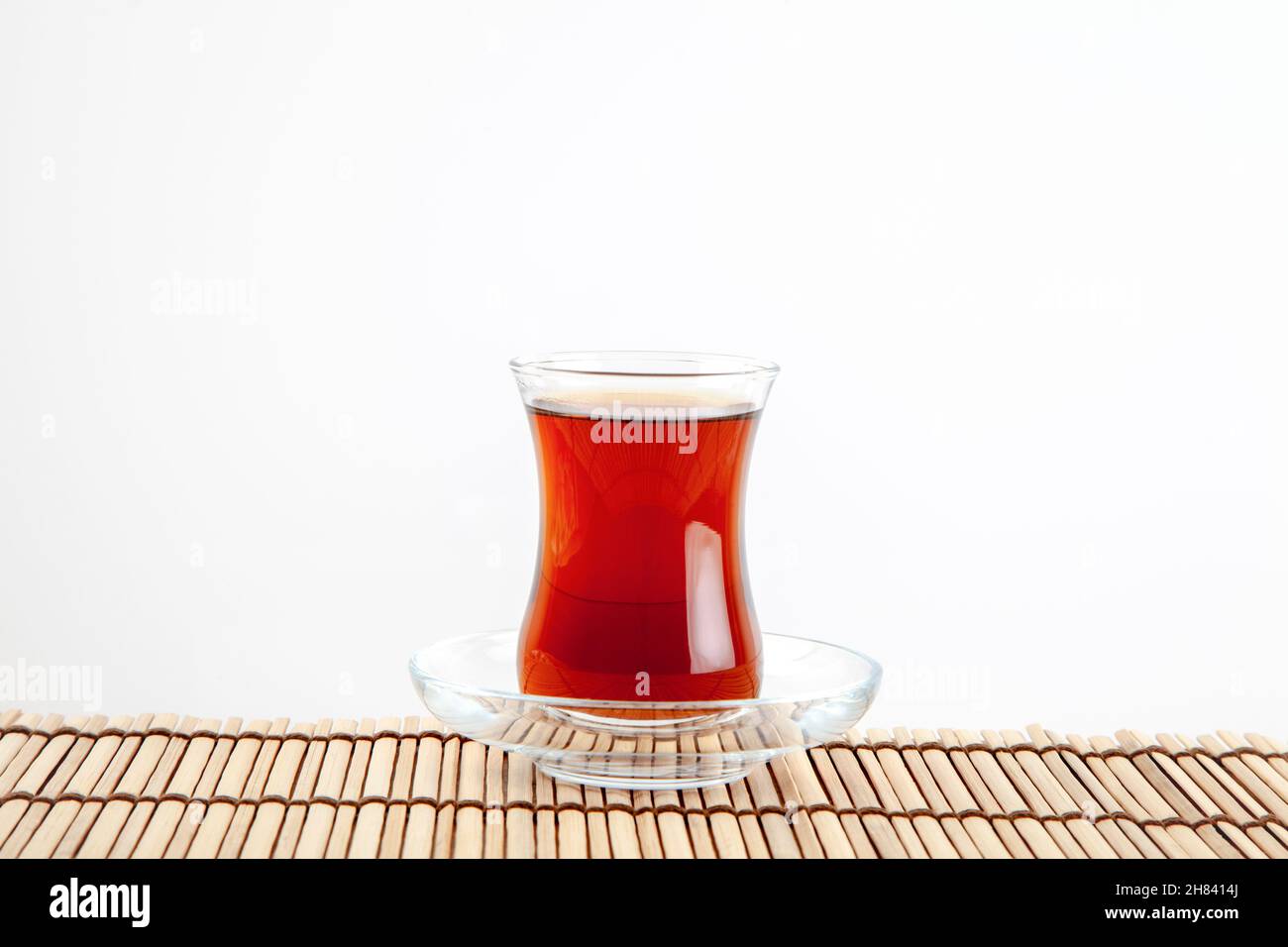 Glass of turkish tea on white background Stock Photo - Alamy