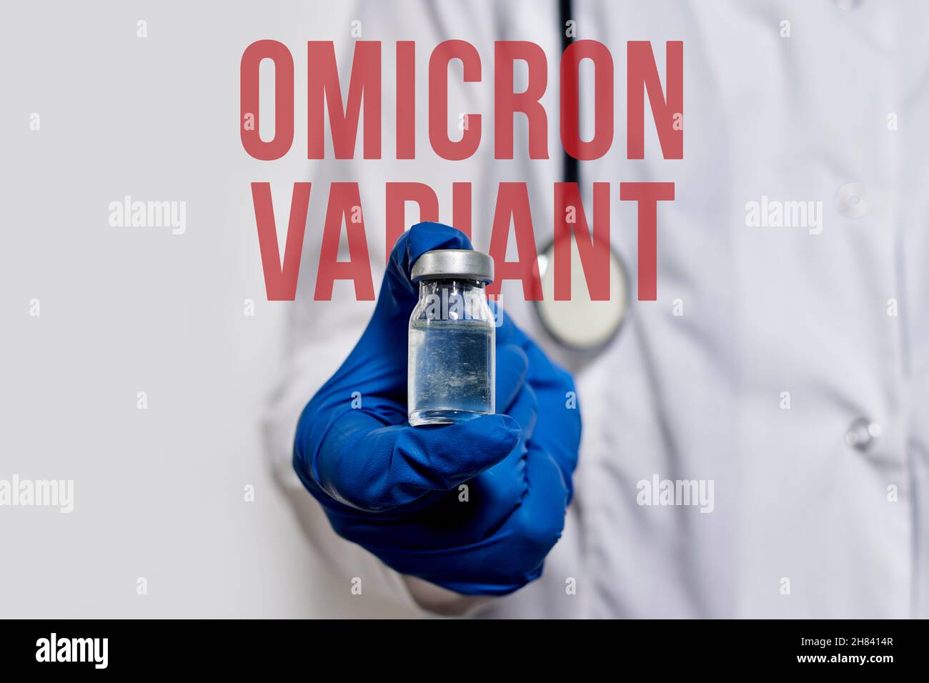 A doctor holds vaccine against new covid-19 omicron variant. New generation vaccine against Coronavirus South African variant. Omicron variant of SARS Stock Photo