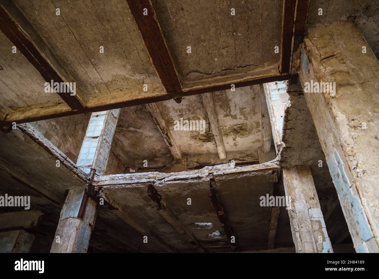 Abandoned concrete construction with destructed ceiling horizontal Stock Photo