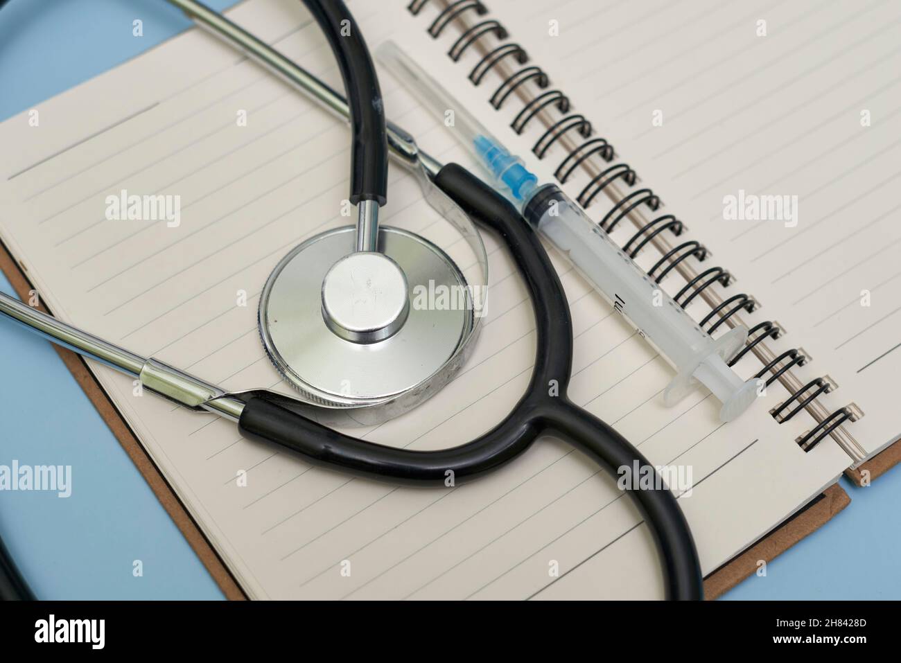 New omicron variant of Covid-19 text on notepad. Workspace or working desktop of doctor, frontliner fighting against covid. New South African variant Stock Photo
