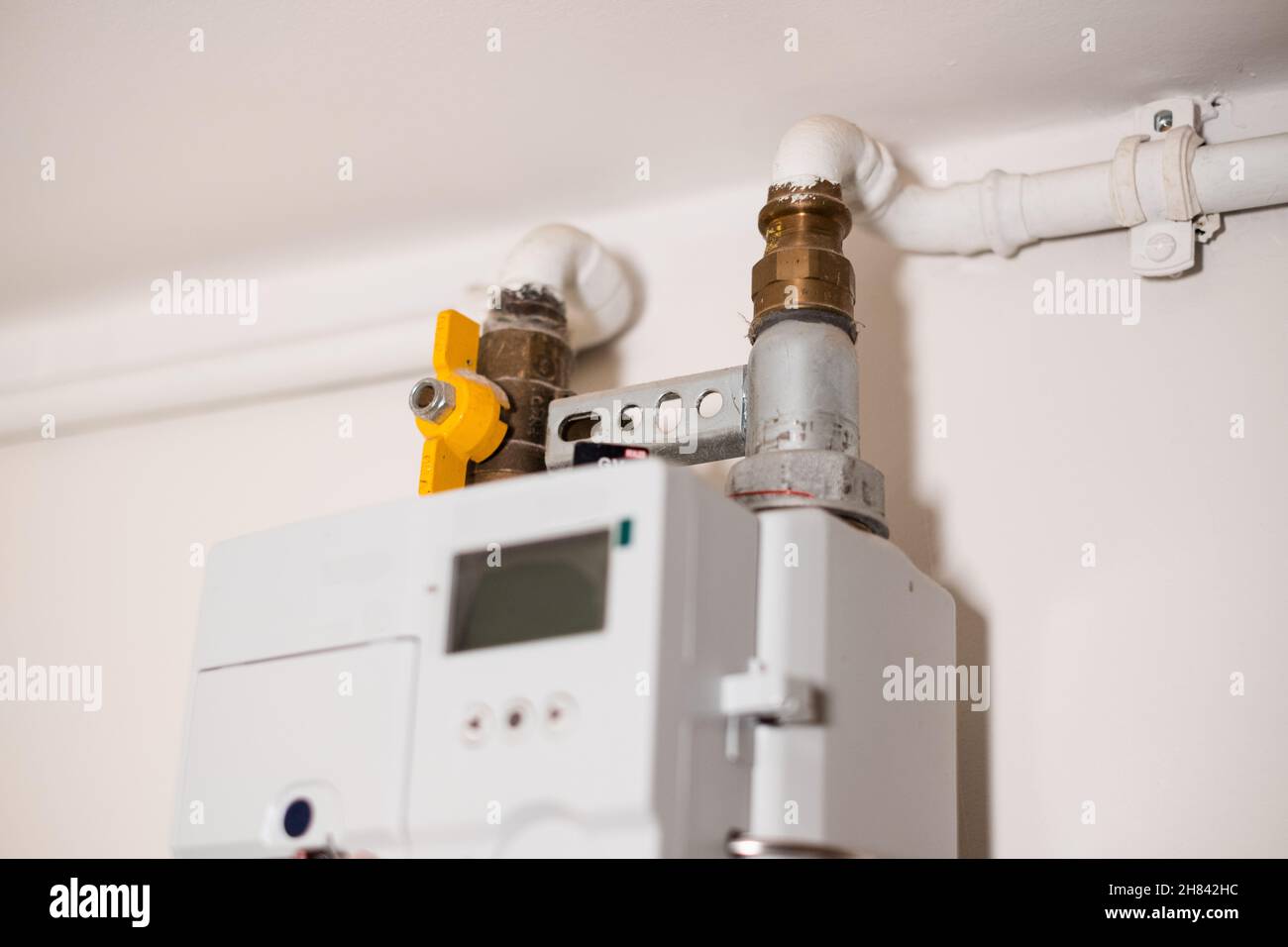 Gas meter measures gas consumption. Gas meter on home indoor wall. High