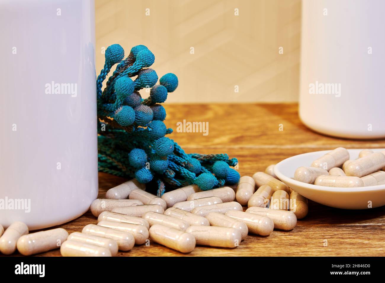 Many medical capsules with herbal powder from flowers. Traditional and