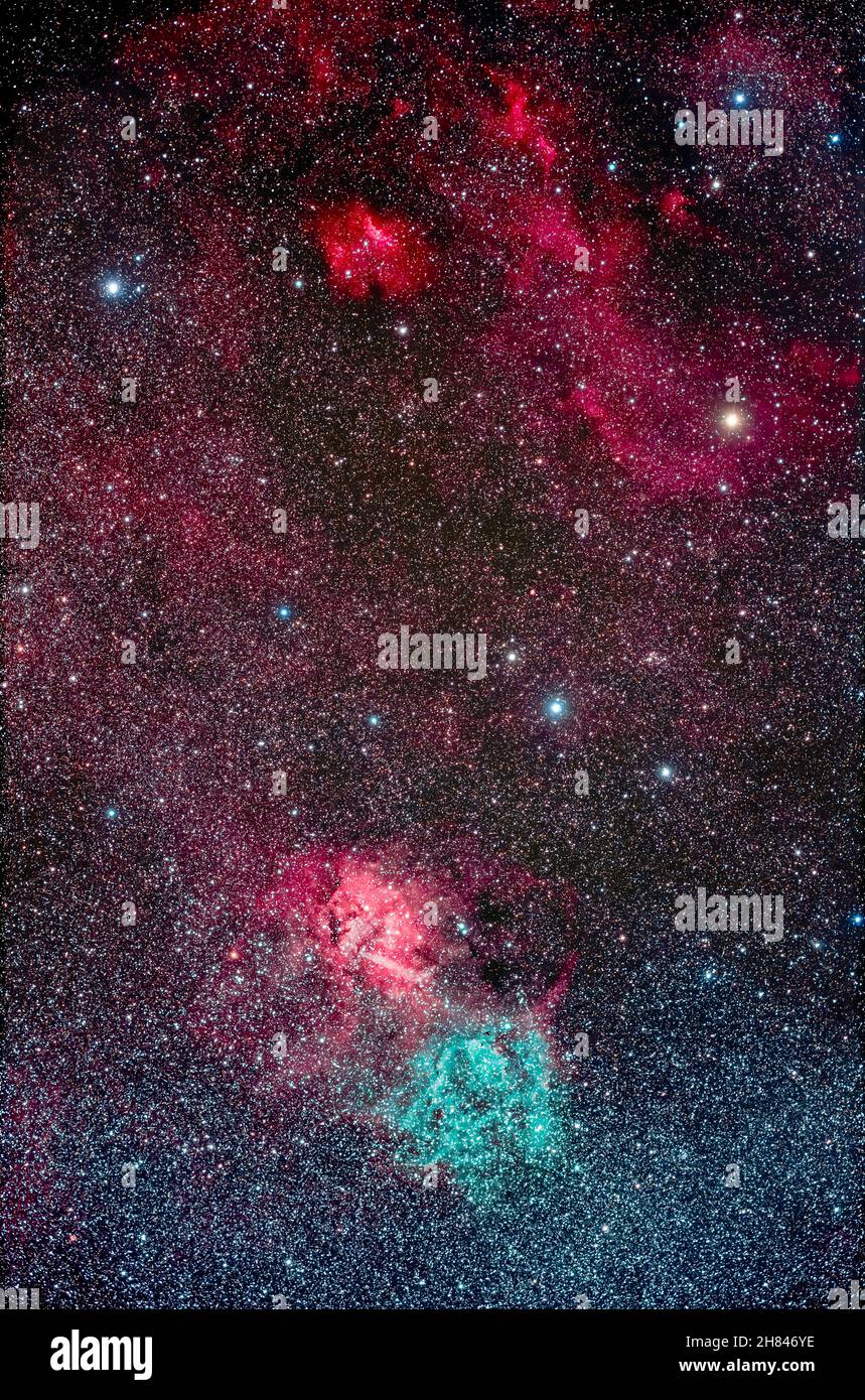 The colourful but obscure area in the Cepheus Milky Way that contains the Lion Nebula (at bottom), a region emitting both red Hydrogen-alpha light and Stock Photo