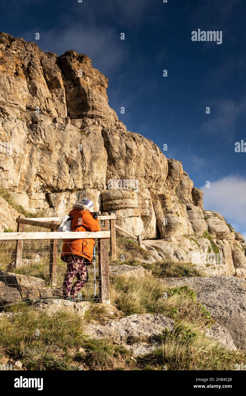 Woman hiking on the great Orme, Llandudno, North Wales Stock Photo