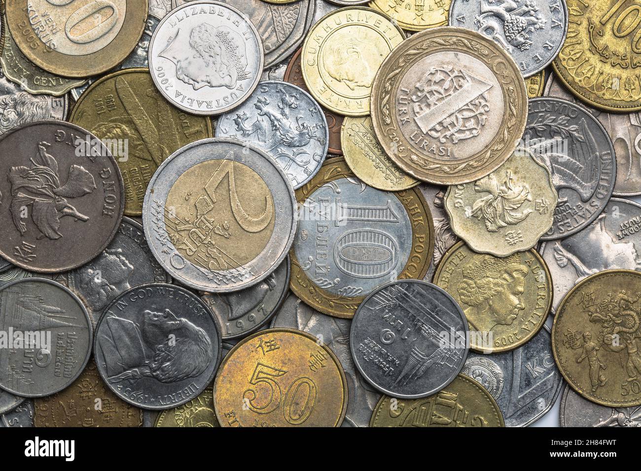 Directly above close-up of the coins from around the World. Stock Photo