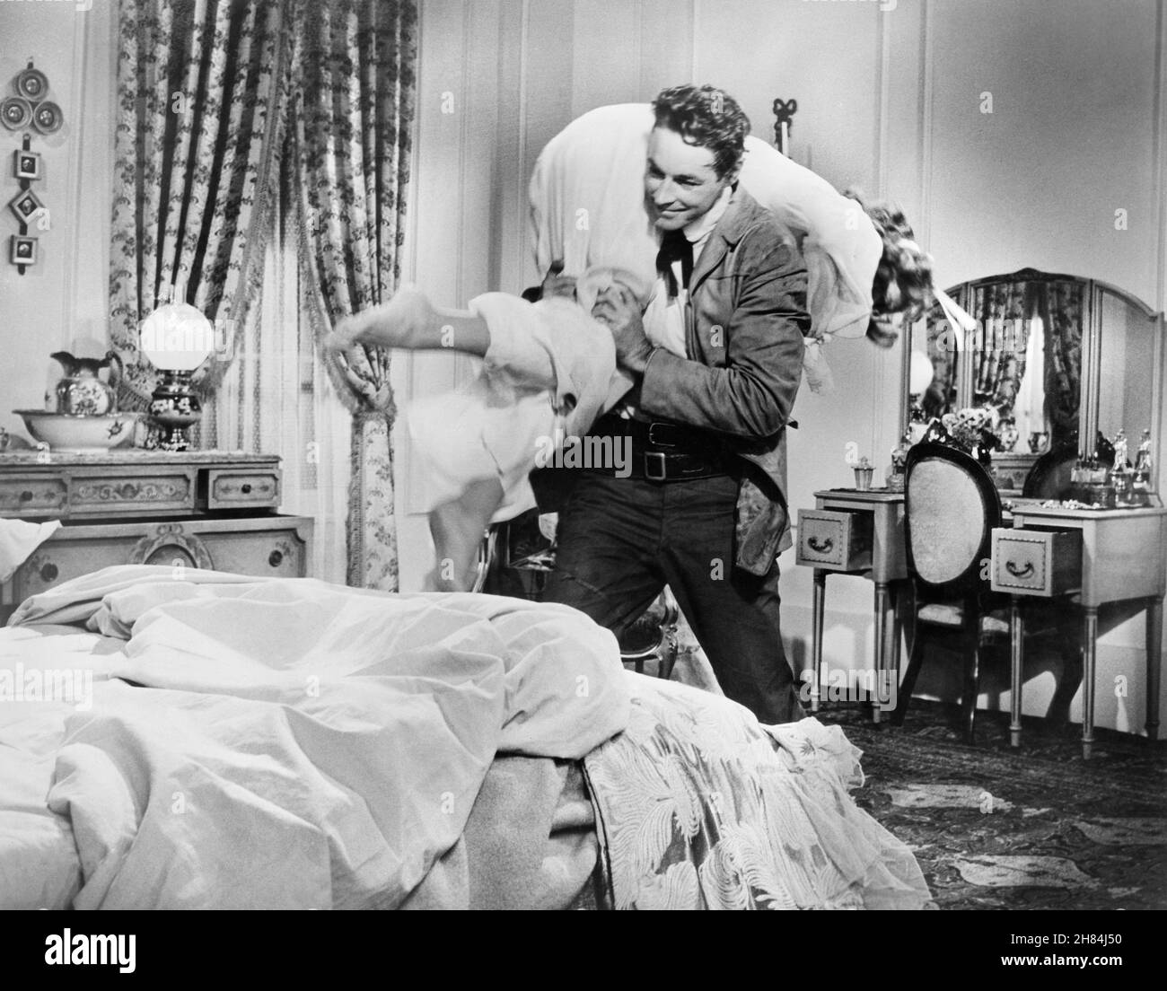 Guy Madison, Rhonda Fleming, on-set of the Film, 'Bullwhip', Allied Artists, 1958 Stock Photo