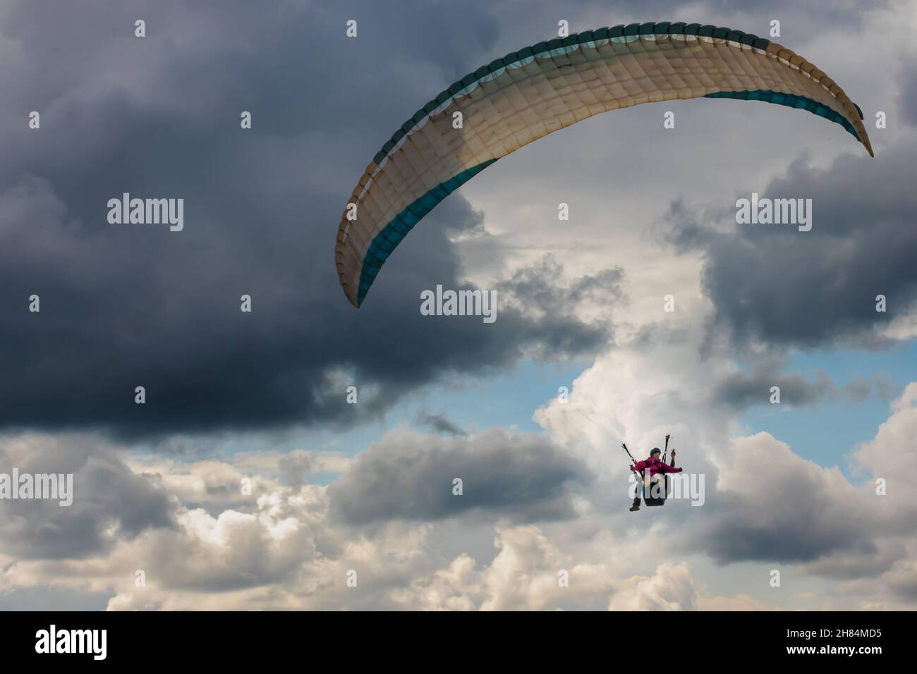 Tandem kite flyers flying in a paraglider Stock Photo