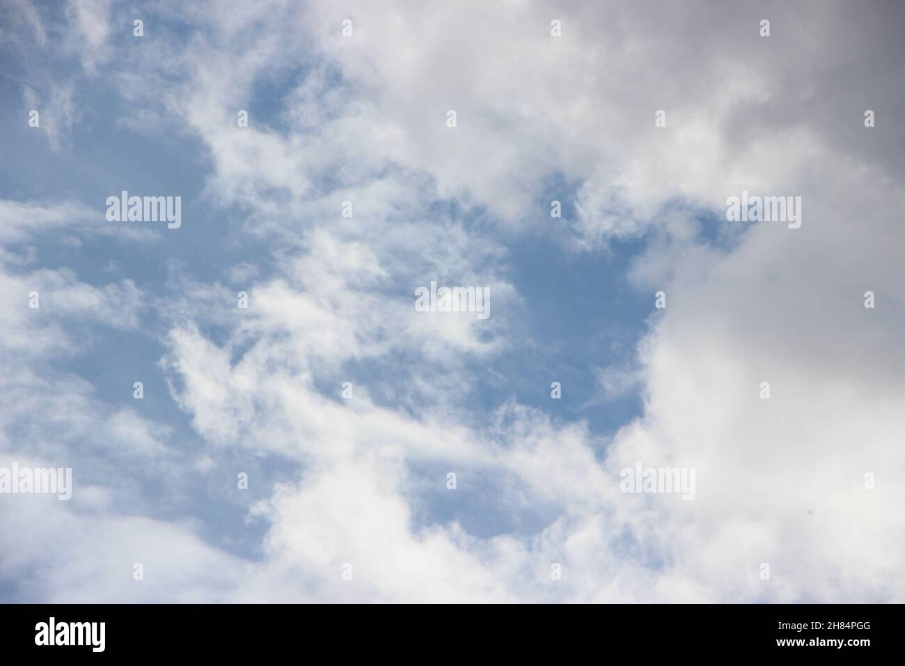 blue sky with white and gray puffy fluffy clouds. weather forecast concept. Stock Photo