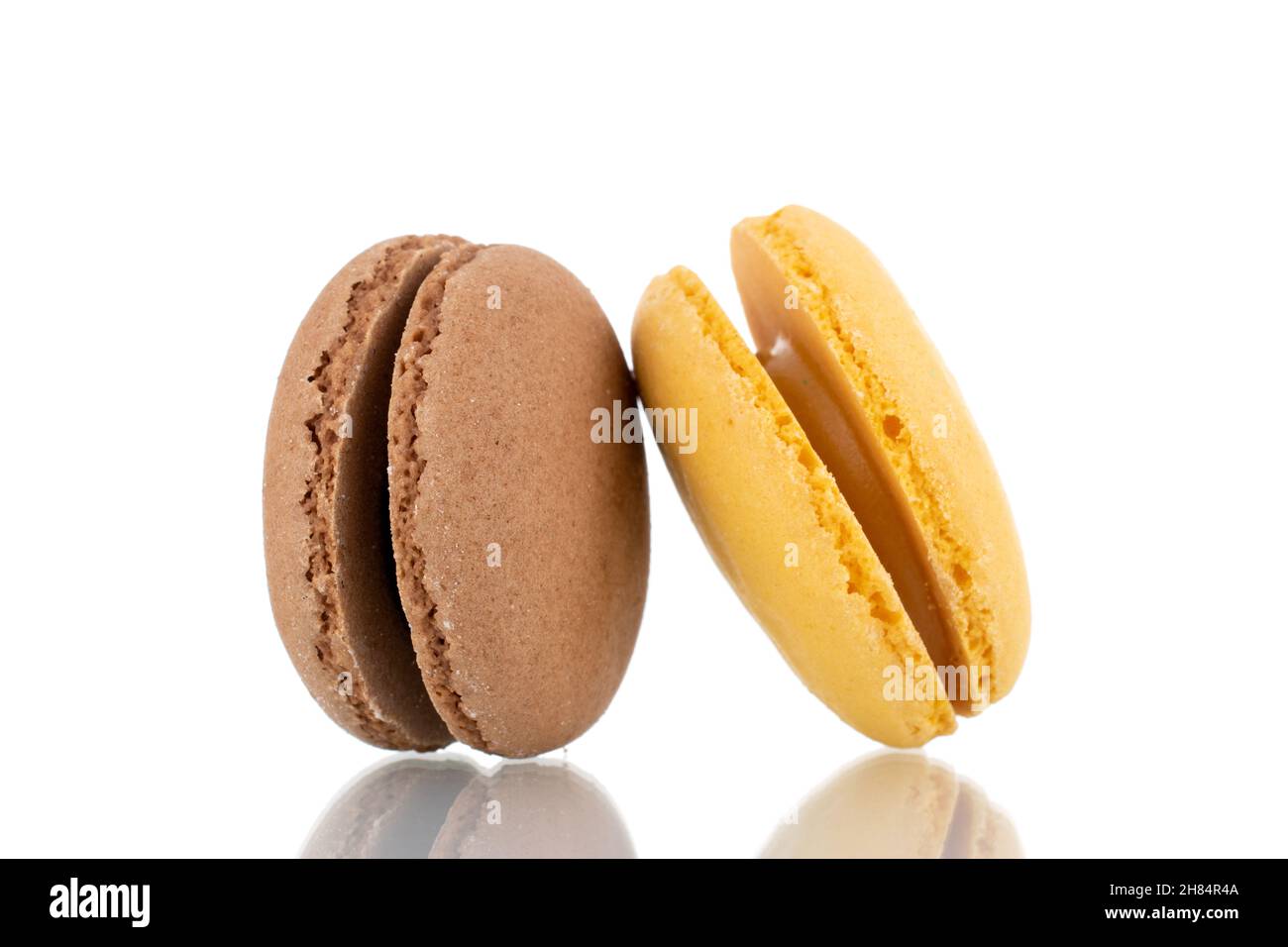 Two sweet macaroons, close-up, isolated on white. Stock Photo