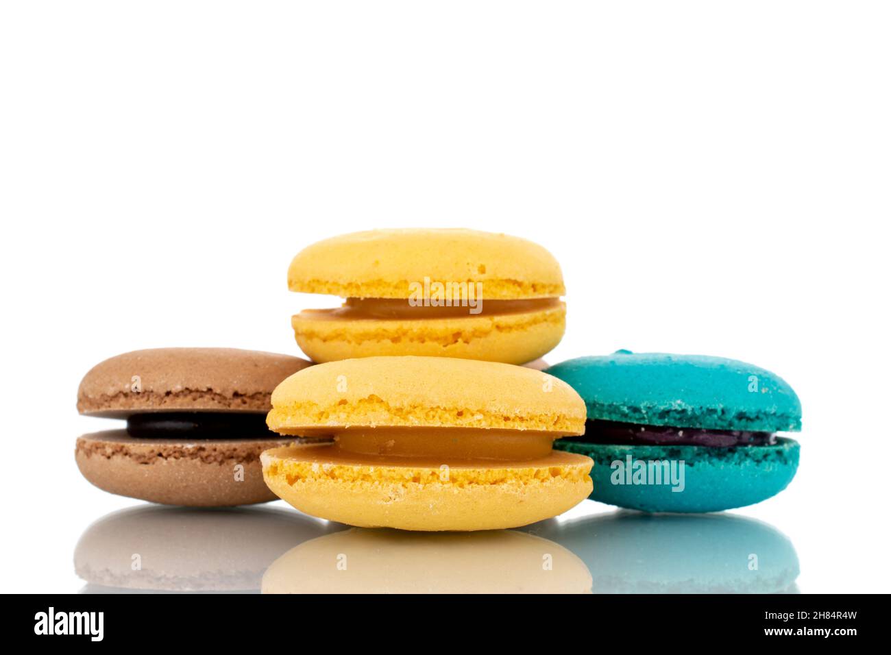 Several sweet macaroons, close-up, isolated on white. Stock Photo