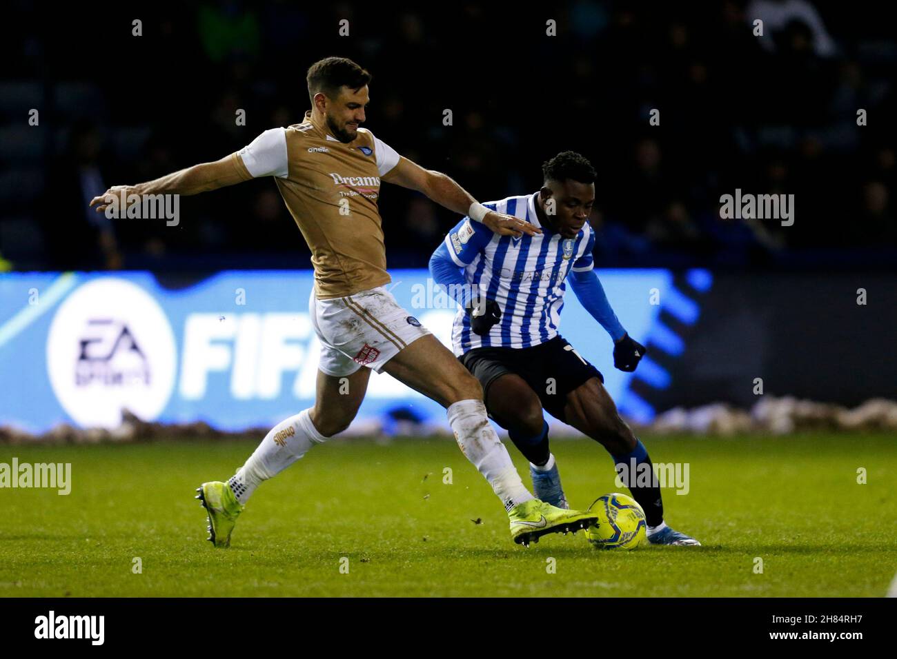 Fisayo Dele-Bashiru #17 of Sheffield Wednesday and Ryan Tafazolli #6 of Wycombe Wanderers Stock Photo