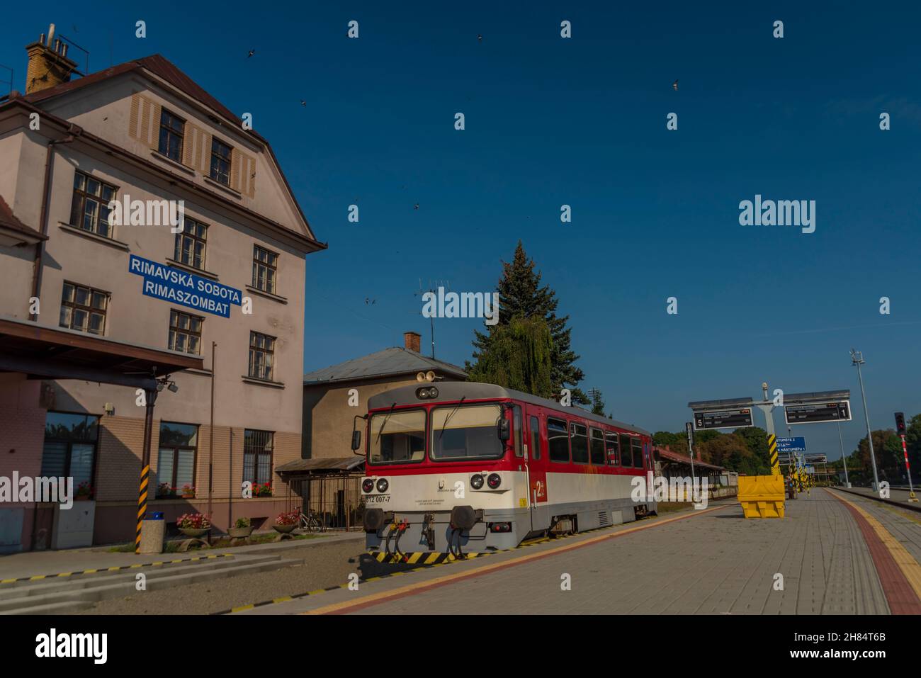 Station with train in Rimavska Sobota town in summer hot color blue sky morning Stock Photo