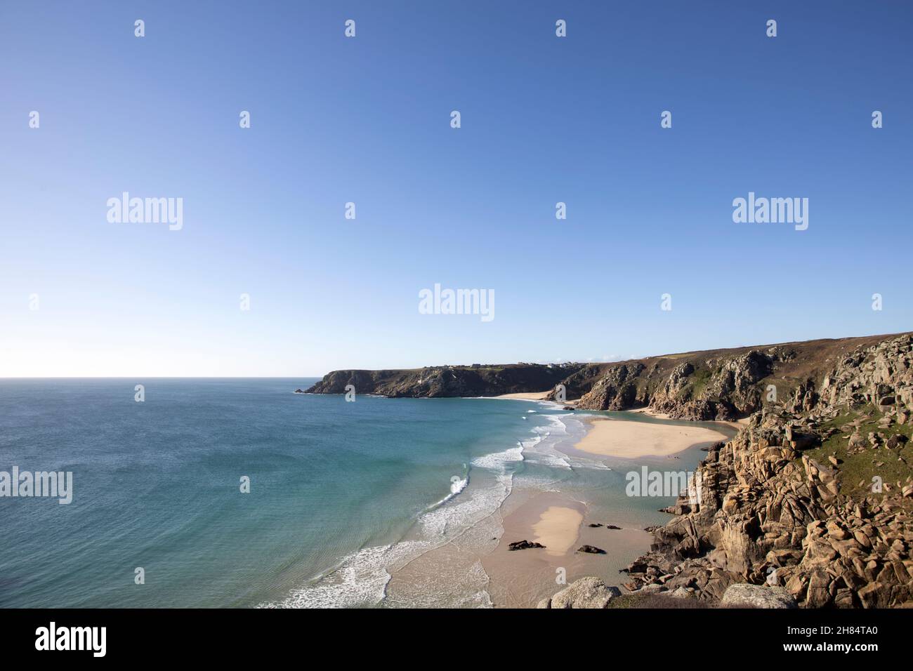 The clear waters of tropical looking Pedn Vounder beach, west Cornwall at low tide in winter. Stock Photo