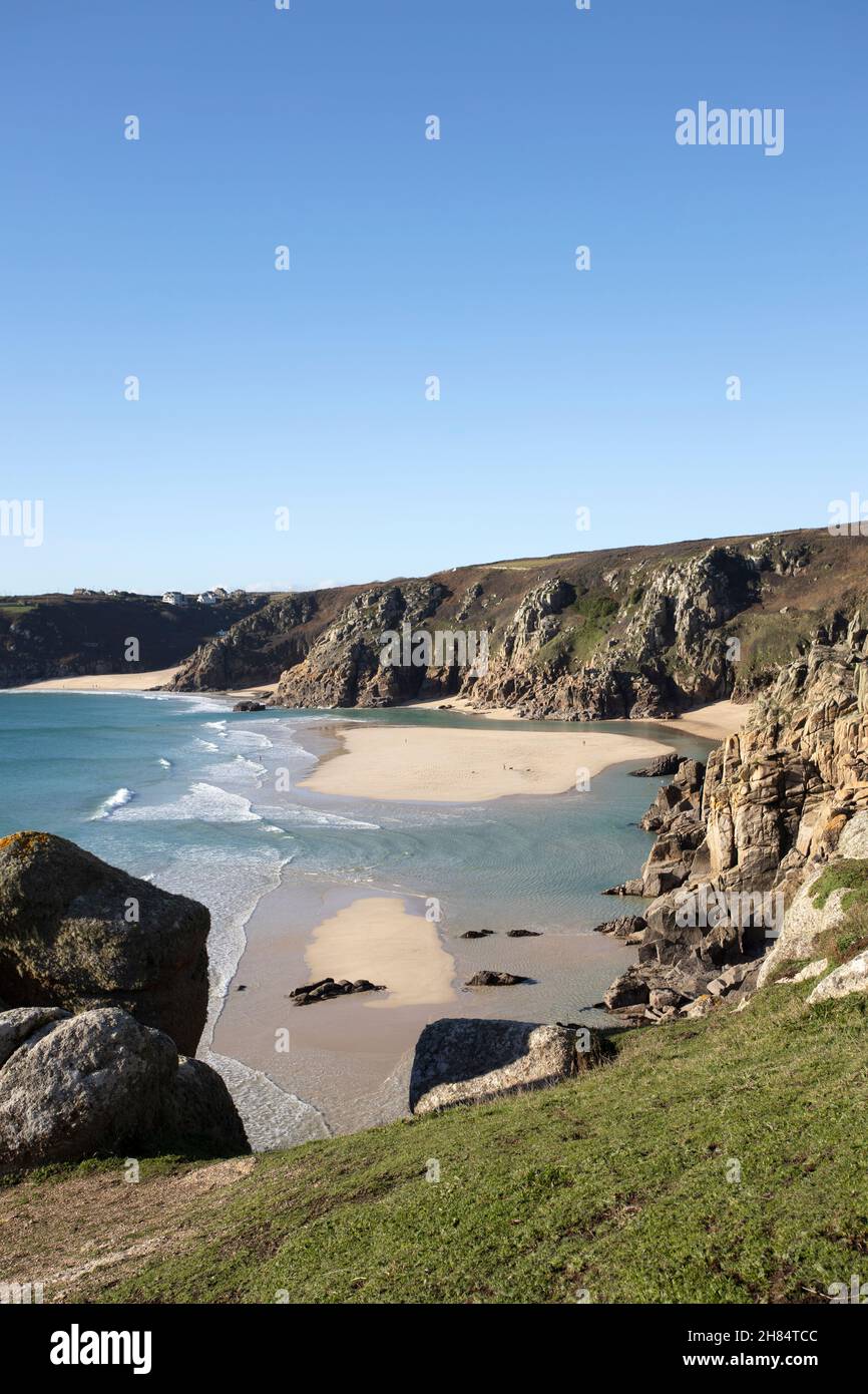The clear waters of tropical looking Pedn Vounder beach, west Cornwall at low tide in winter. Stock Photo