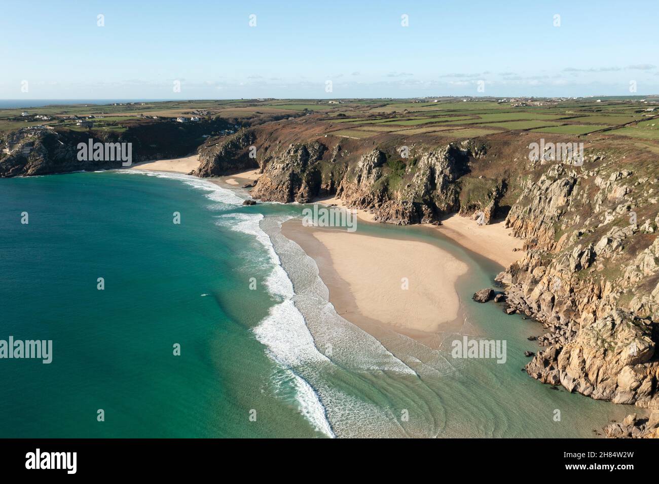 Aerial view of the clear waters of tropical looking Pedn Vounder beach, west Cornwall at low tide in winter. Stock Photo