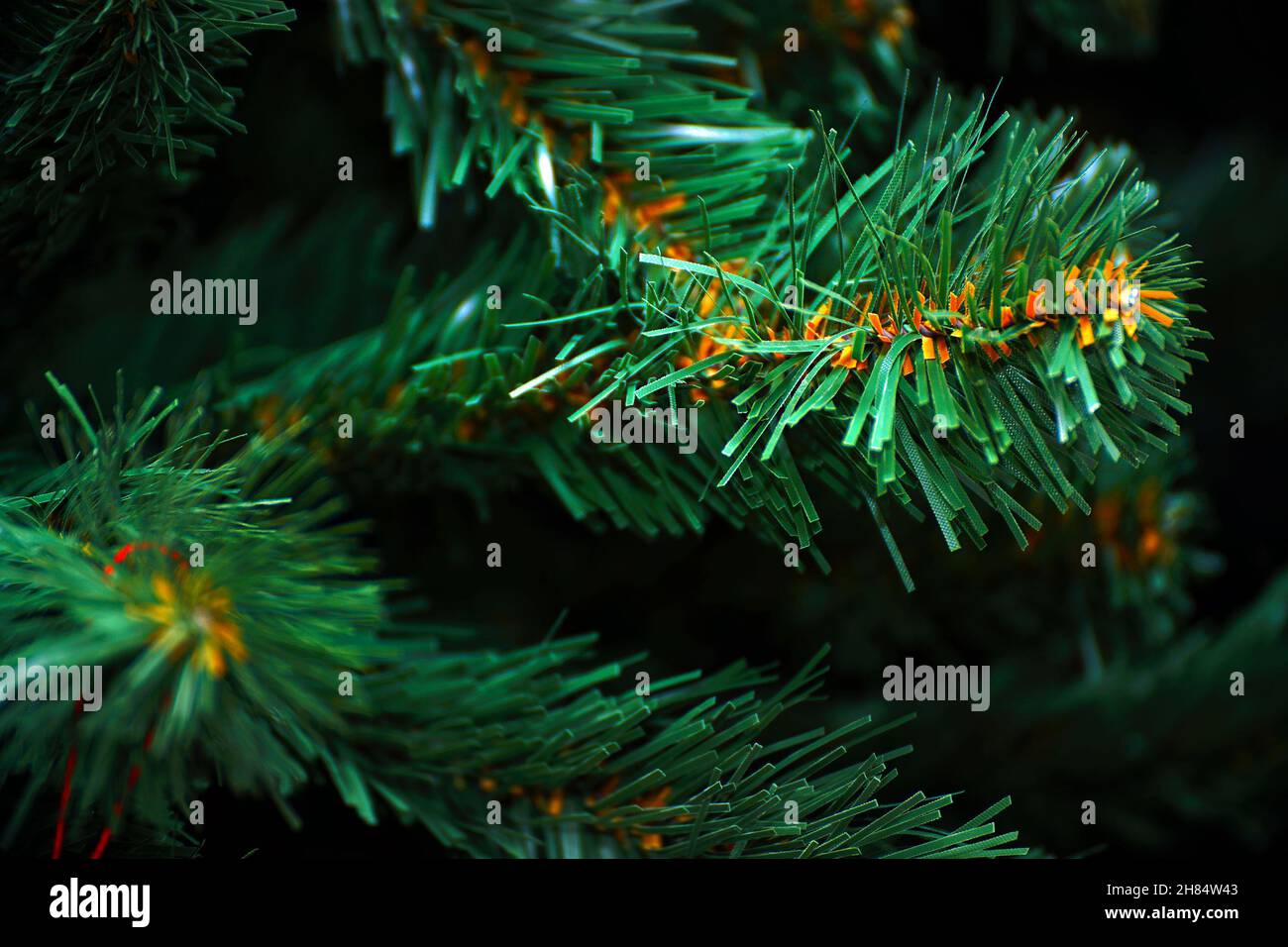 Artificial needles on a synthetic Christmas tree. Artificial Christmas tree Stock Photo