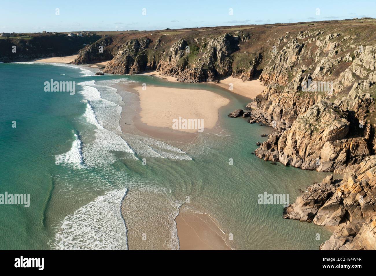 Aerial view of the clear waters of tropical looking Pedn Vounder beach, west Cornwall at low tide in winter. Stock Photo