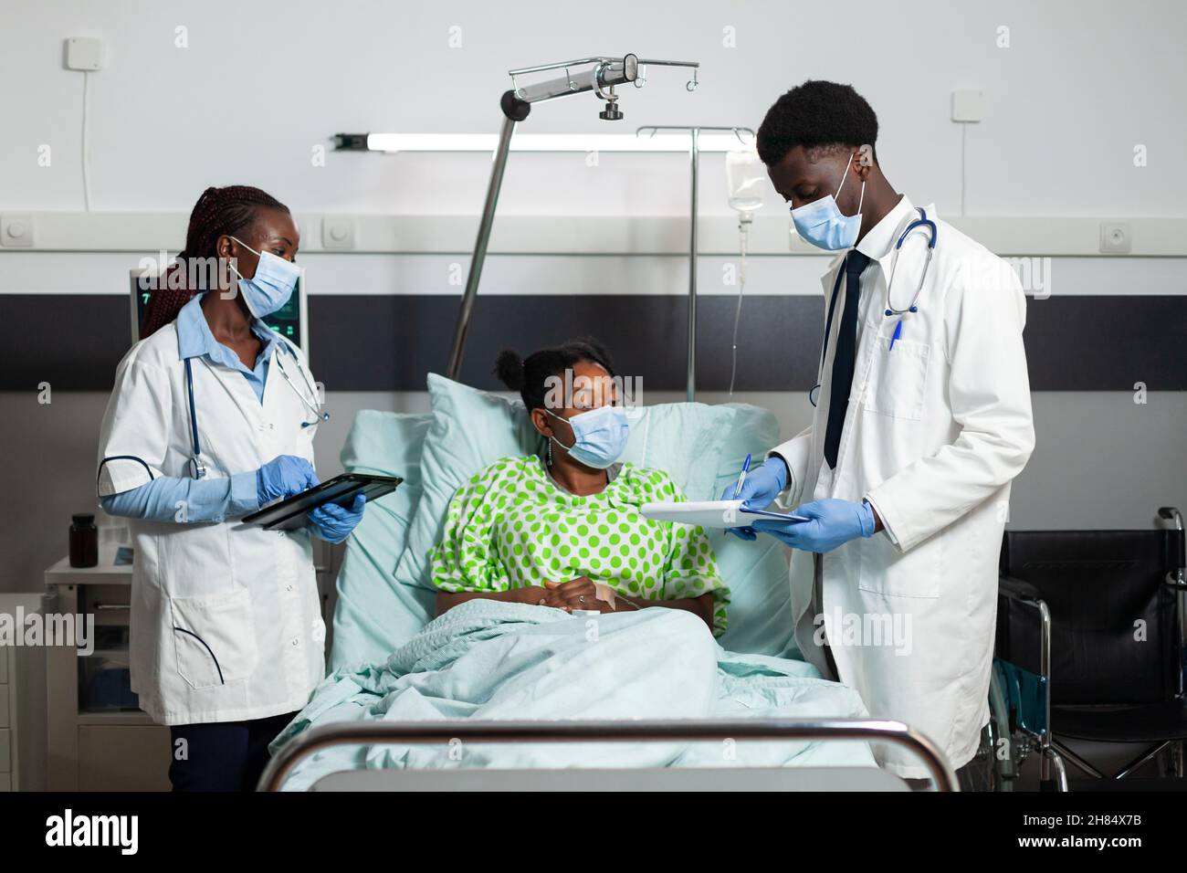 Medical team with protective face masks to prevent infection with