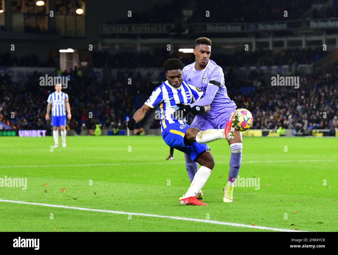 Brighton, UK. 27th Nov, 2021. Tariq Lamptey of Brighton and Hove Albion manages to cross the ball into the box under pressure from Junior Firpo of Leeds United during the Premier League match between Brighton & Hove Albion and Leeds United at The Amex on November 27th 2021 in Brighton, England. (Photo by Jeff Mood/phcimages.com) Credit: PHC Images/Alamy Live News Stock Photo