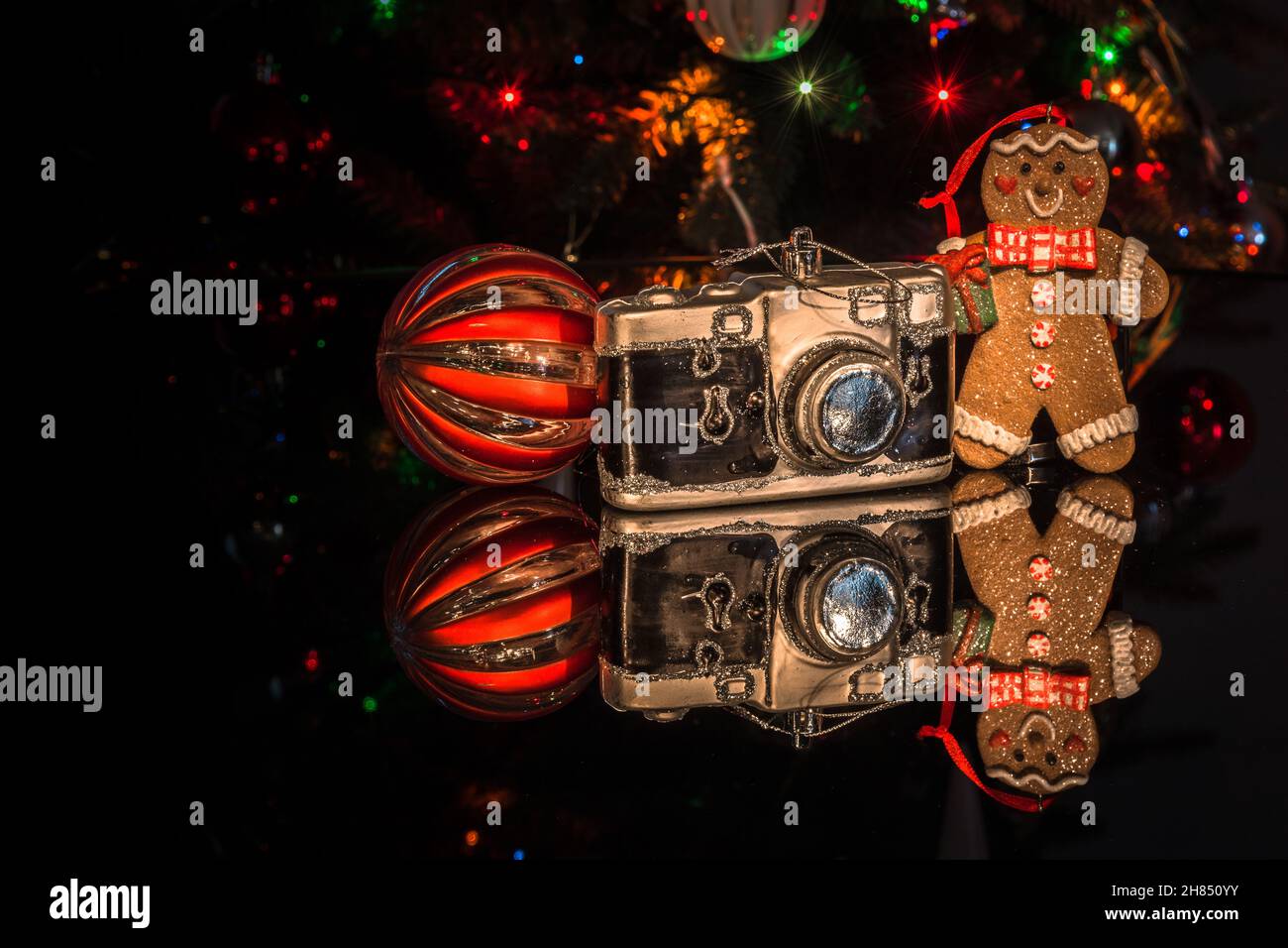 Christmas decoration with a gingerbread man, a camera, a ball and ...