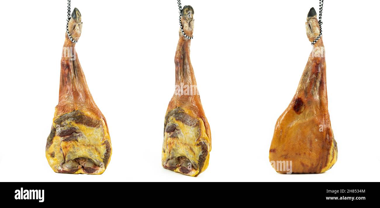 Three pork shoulder cured on white background. Cured pork meat. Typical Spanish food. Stock Photo