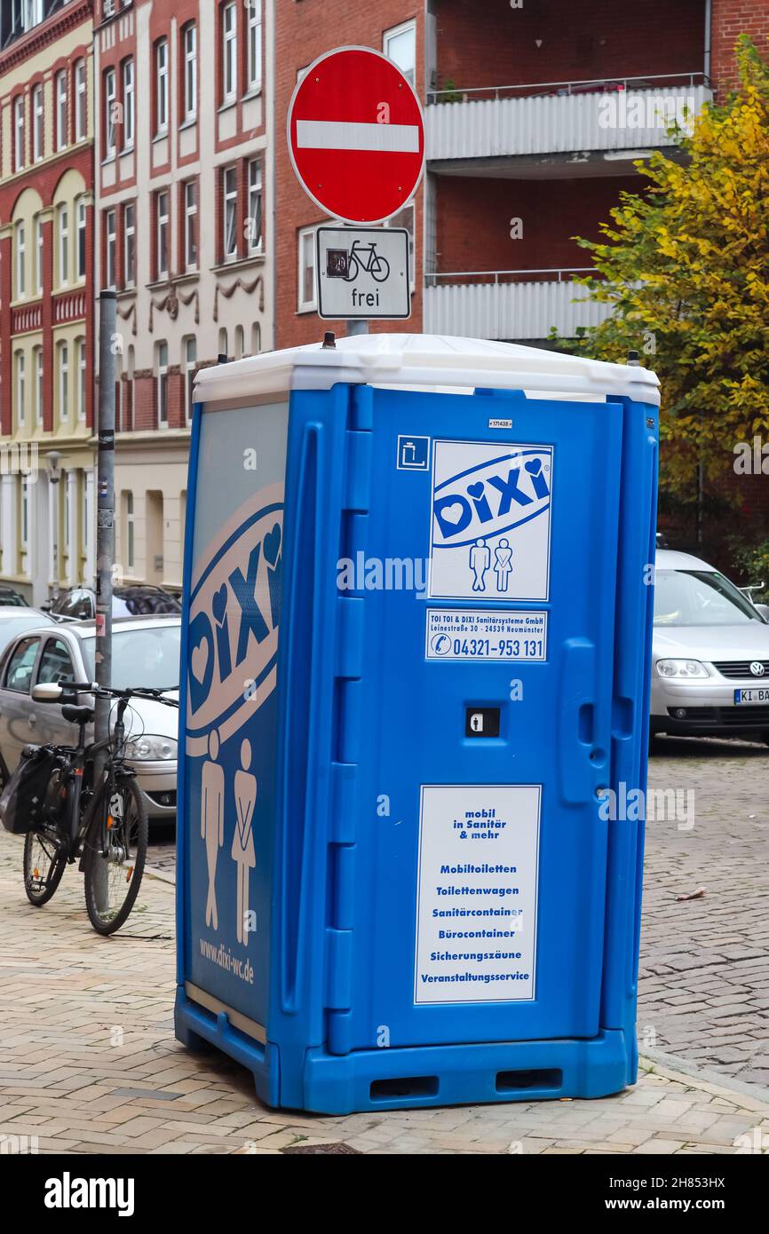 KIEL, GERMANY - Oct 30, 2021: A vertical shot of a portable toilet in a blue plastic house of the company Dixi in Kiel, Germany Stock Photo