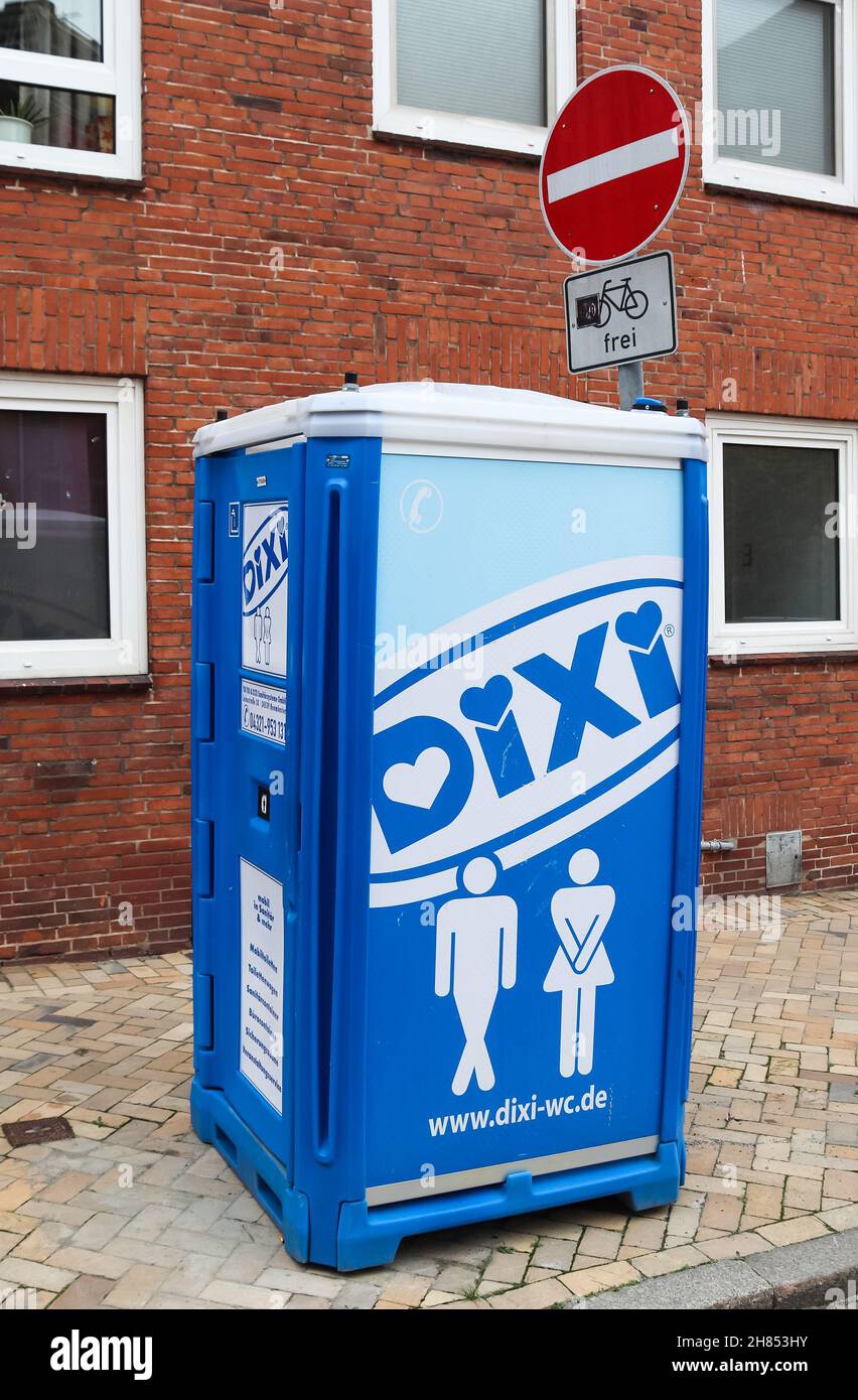 KIEL, GERMANY - Oct 30, 2021: A vertical shot of a portable toilet in a blue plastic house of the company Dixi in Kiel, Germany Stock Photo
