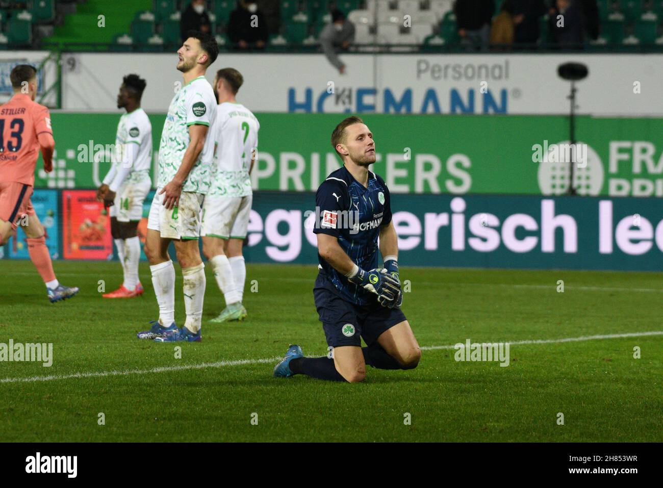 Deutschland, Fuerth, Sportpark Ronhof Thomas Sommer - 27.11.2021 - Fussball, 1.Bundesliga - SpVgg Greuther Fuerth vs. TSG 1899 Hoffenheim  Image: GK Marius Funk (SpVgg Greuther Fürth,1) kneels in shock after the the 4th goal in conceded in the 57th minute; Goalscorer was Georginio Rutter (TSG 1899 Hoffenheim, 33)  DFL regulations prohibit any use of photographs as image sequences and or quasi-video Stock Photo