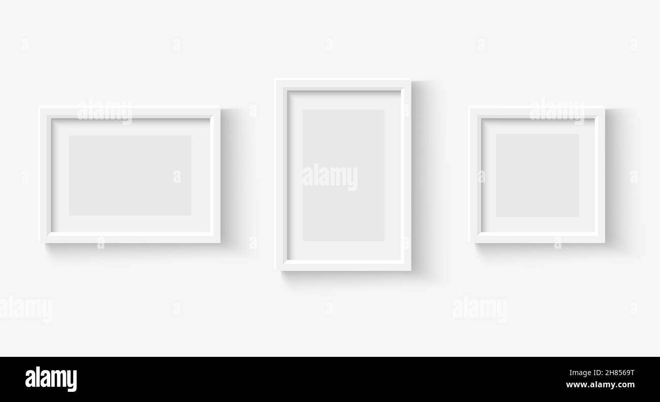 Photo frames on wall. White picture frame set. Vector empty realistic