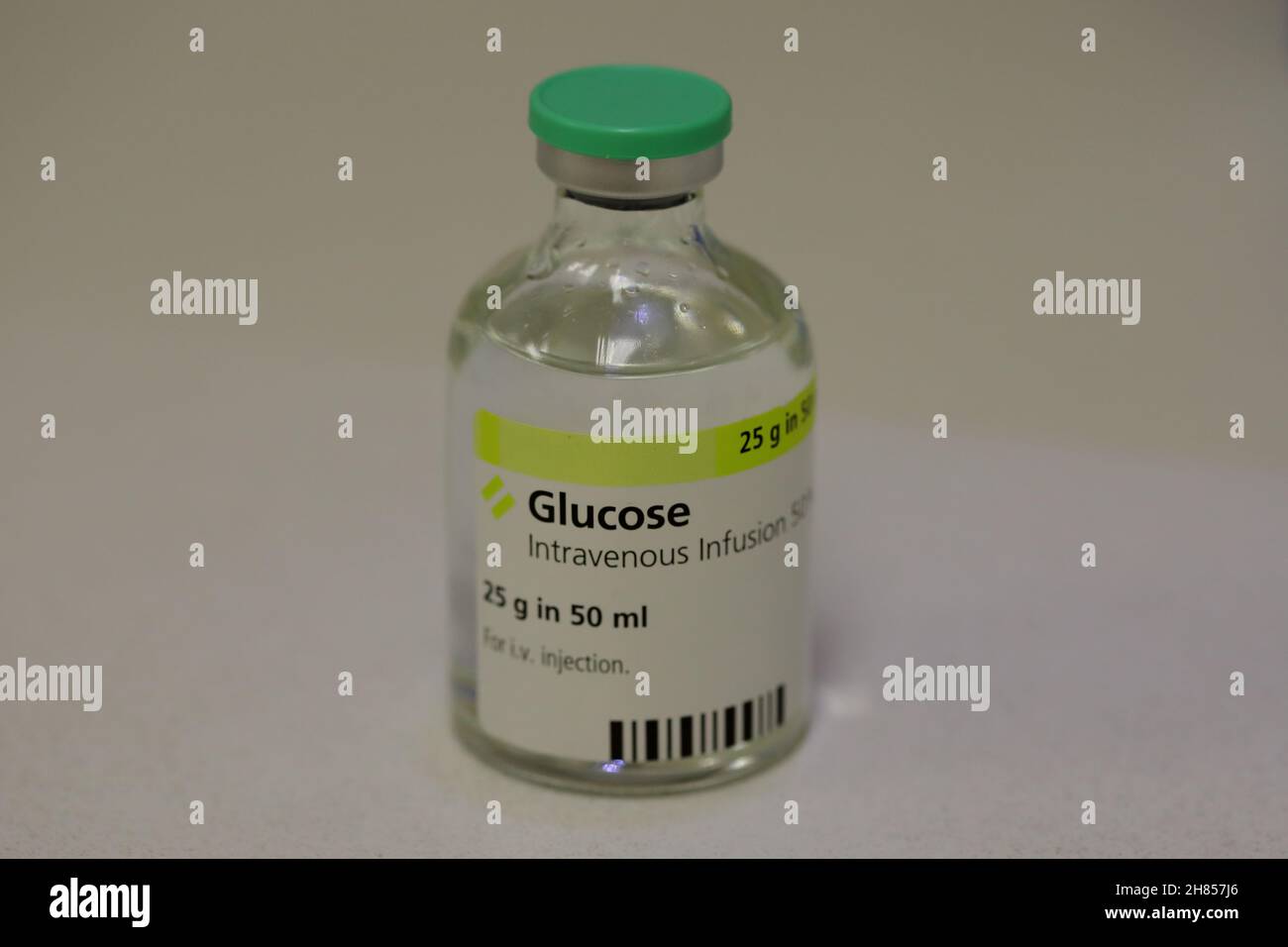 a 50ml glass bottle containing 25g of glucose solution for intravenous infusion Stock Photo