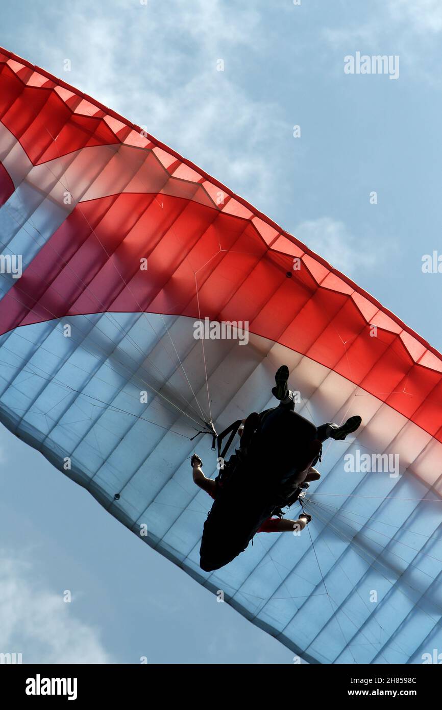 people flying paragliders seen completely from below Stock Photo